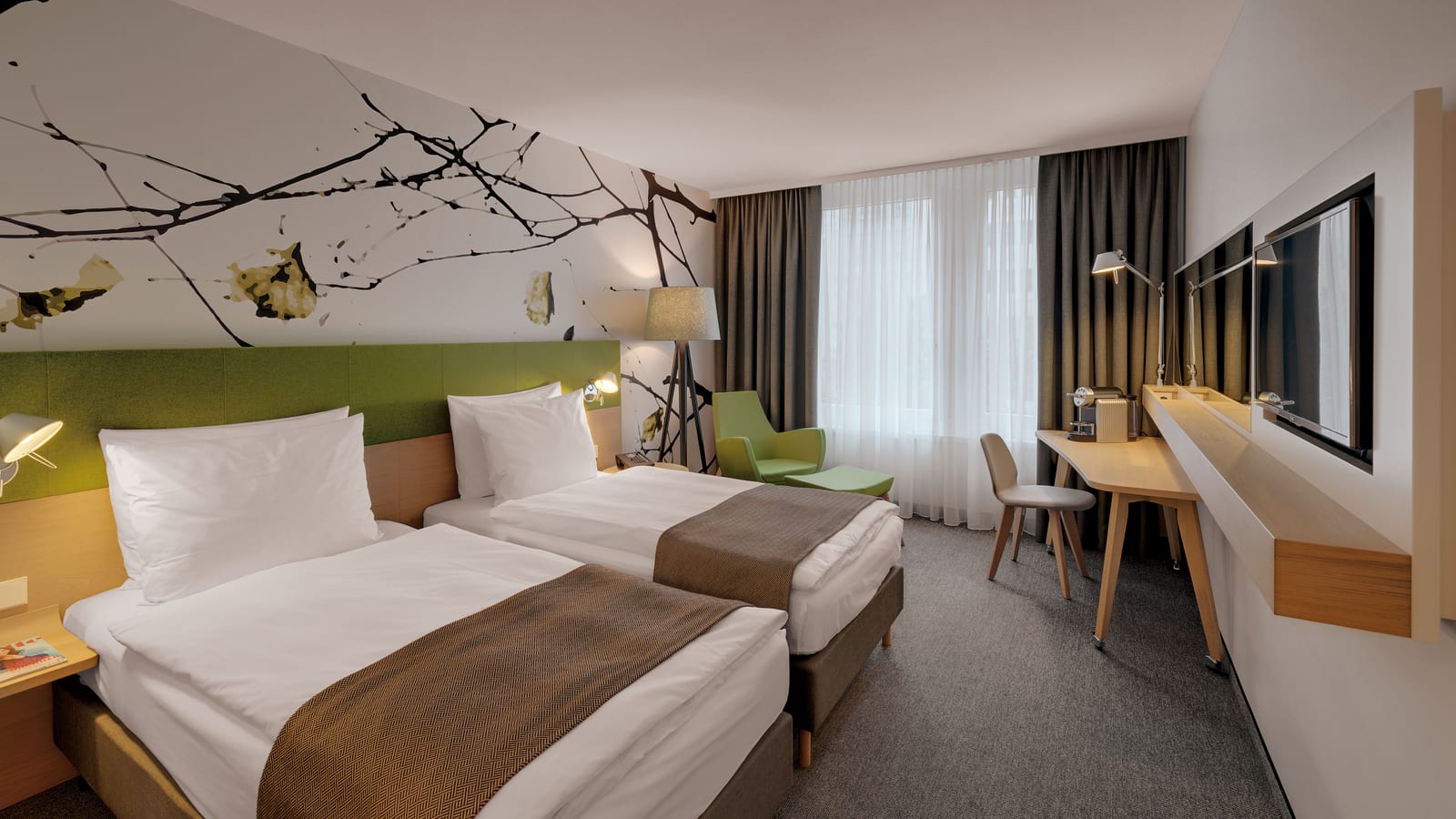 A twin room at Holiday Inn Frankfurt - Alte Oper, with connecting rooms available for families under the Kids Eat and Stay Free policy.